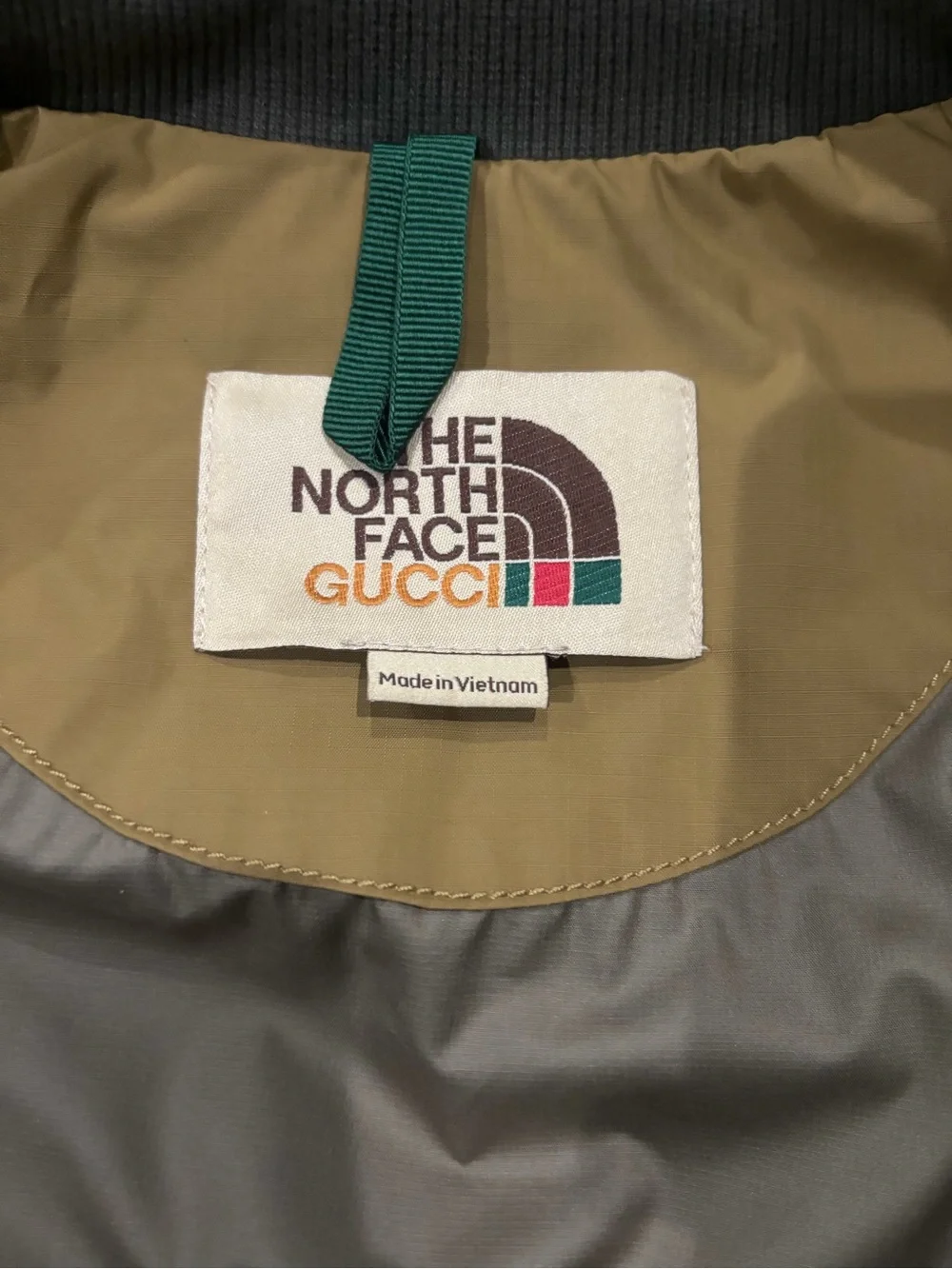The North Face Olive Green Bomber Jacket with Logo Patch with garment bag & box